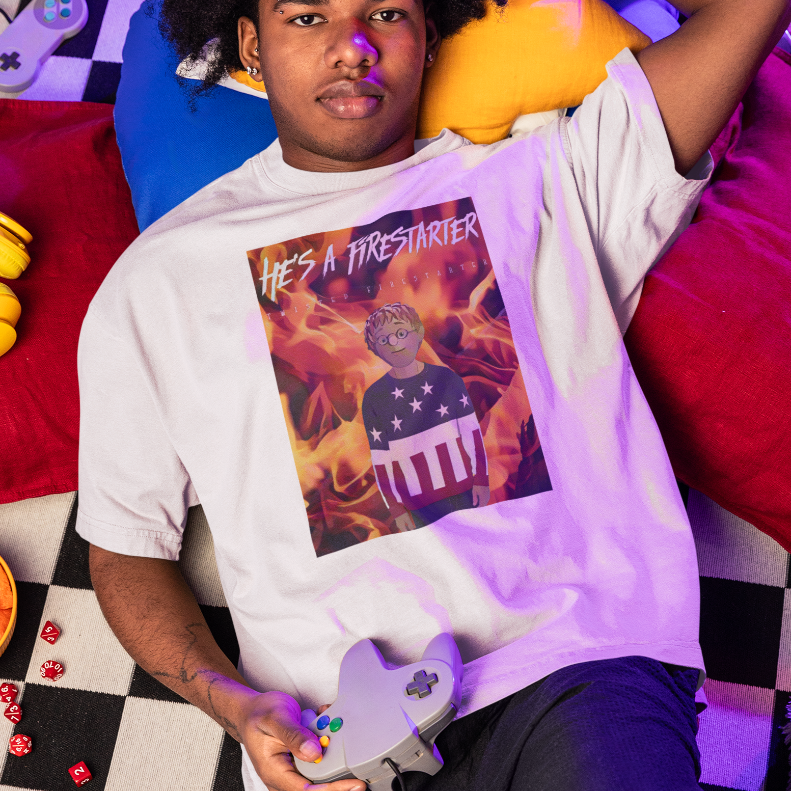 Man wearing a He's a Firestarter  t-shirt in a colorful room with checkered floororman Price