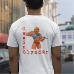 Person wearing a white t-shirt with Owain Glyndwr design on the back, standing on a street.