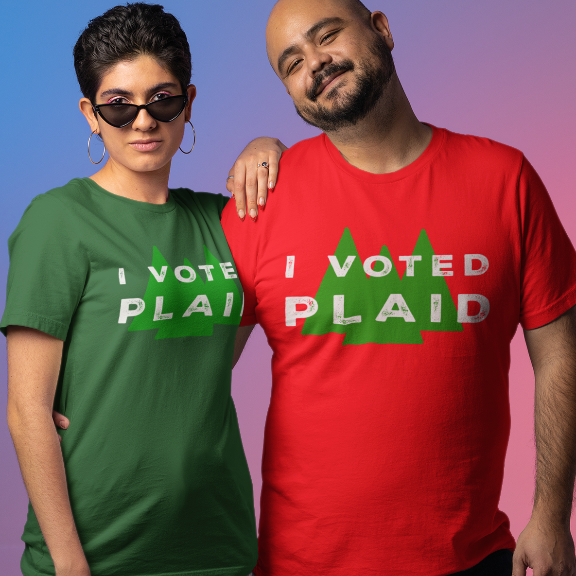 Two people wearing 'I Voted Plaid' t-shirts against a gradient background