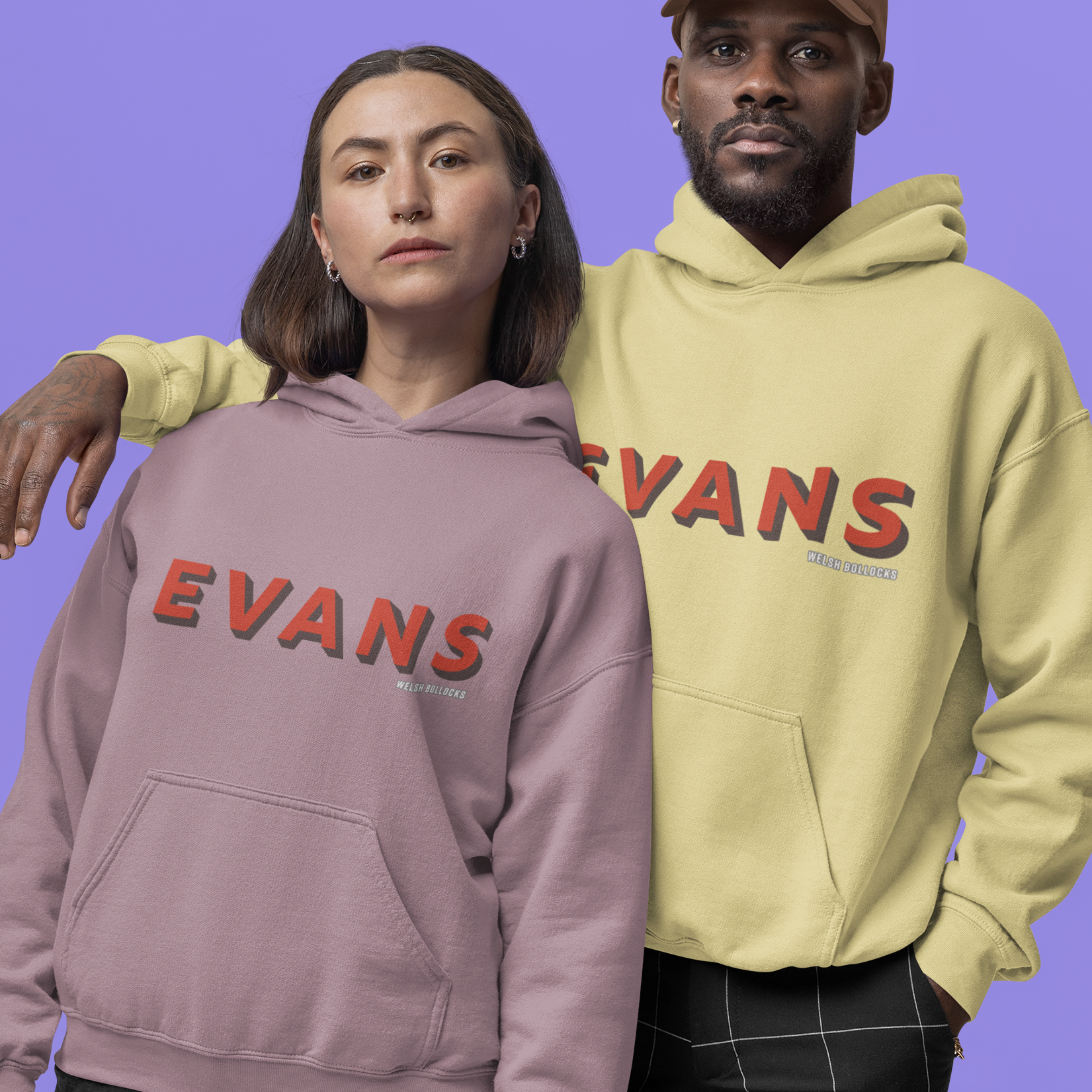 Two people wearing 'Evans' branded hoodies against a purple background