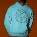 A model wearing a light blue hoodie with a black circular text graphic on the front, set against a solid orange background.