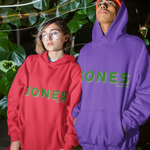 Two people wearing red and purple 'JONES' hoodies standing outdoors at night.