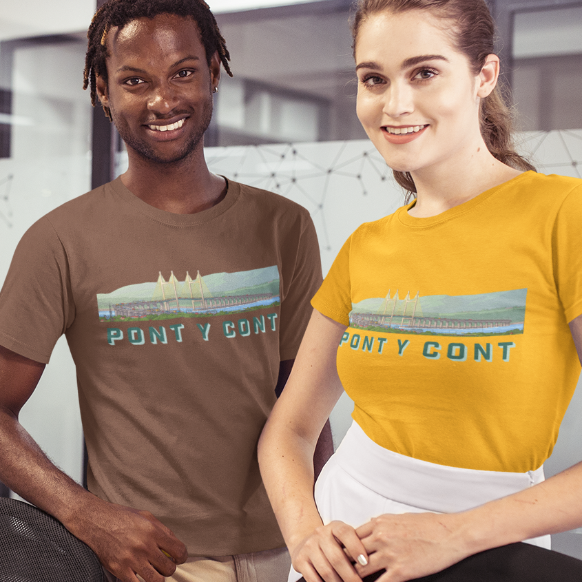 Two models in an office setting wearing matching PONTY CONT graphic t-shirts, one in brown and one in mustard yellow, with a black jacket draped over the woman.