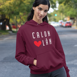 Woman in maroon hoodie with 'Caloh Lan' logo walking a dog on a street.