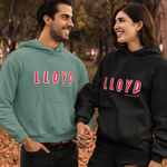 Two people wearing 'LLOYD' hoodies standing outdoors with trees in the background.