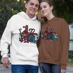 A man and a woman standing together on an outdoor paved walkway, wearing matching custom graphic hoodies. The man wears a white hoodie with the Penscynor logo, and the woman wears a brown hoodie with the same Penscynor logo.