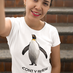 A woman wearing a white crewneck t-shirt with a graphic of a penguin and the Welsh text 'CONT Y RHEW' below it, posing in front of outdoor brick steps.