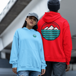 Two people wearing hoodies with visible logos outdoors.
