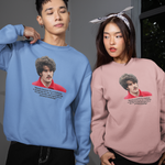 Two people wearing sweatshirts with a graphic of a person in a red shirt and text.