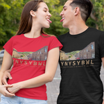 A man and a woman standing on a paved outdoor walkway, each wearing a matching graphic t-shirt in red and black, paired with distressed light blue jeans and white sneakers.